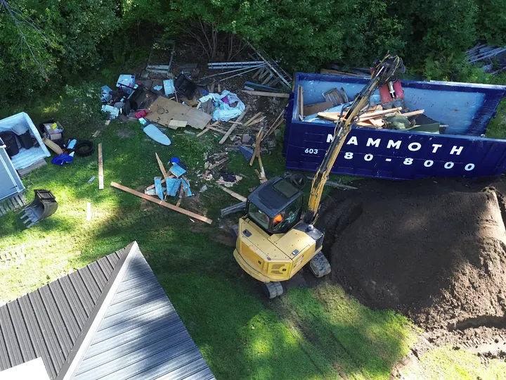 Drone view of the yard being cleaned up after a shed teardown