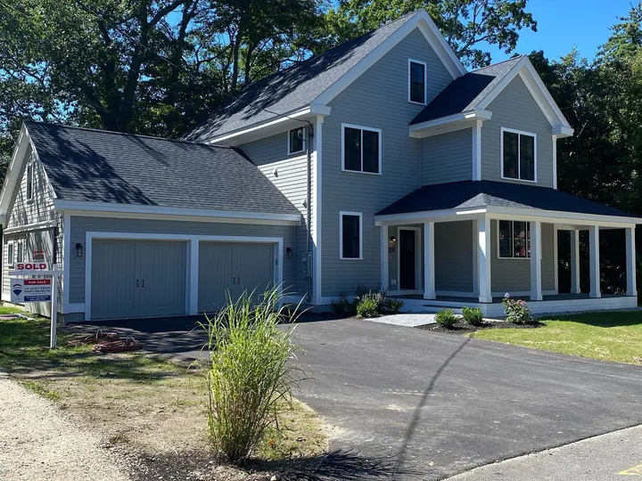 Finished two story home with a paved driveway on a new lot