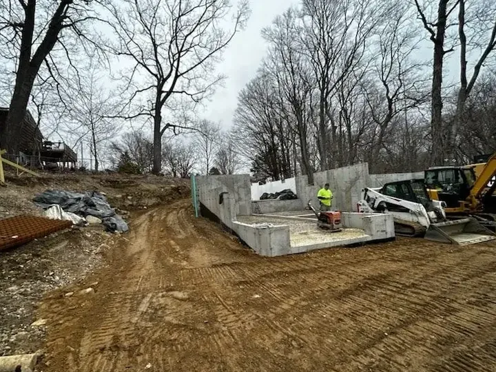 Fresh concrete foundation walls inside a new home dig