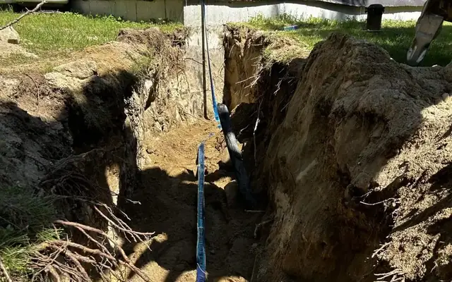 Emergency water line repair near a home on the New England Seacoast